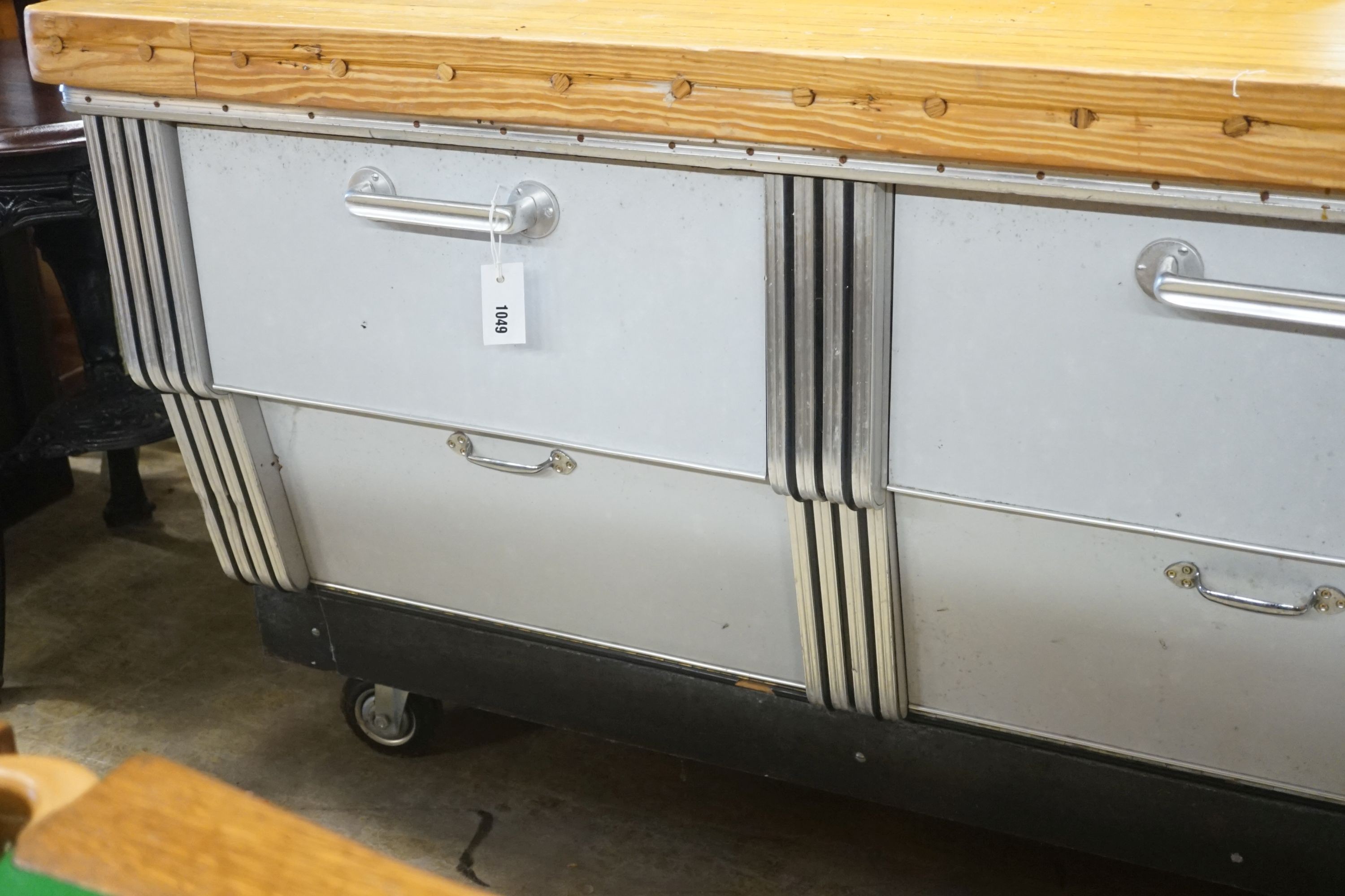 A mid 20th century shop counter cabinet with pine strip work top, width 152cm depth 71cm height 88cm